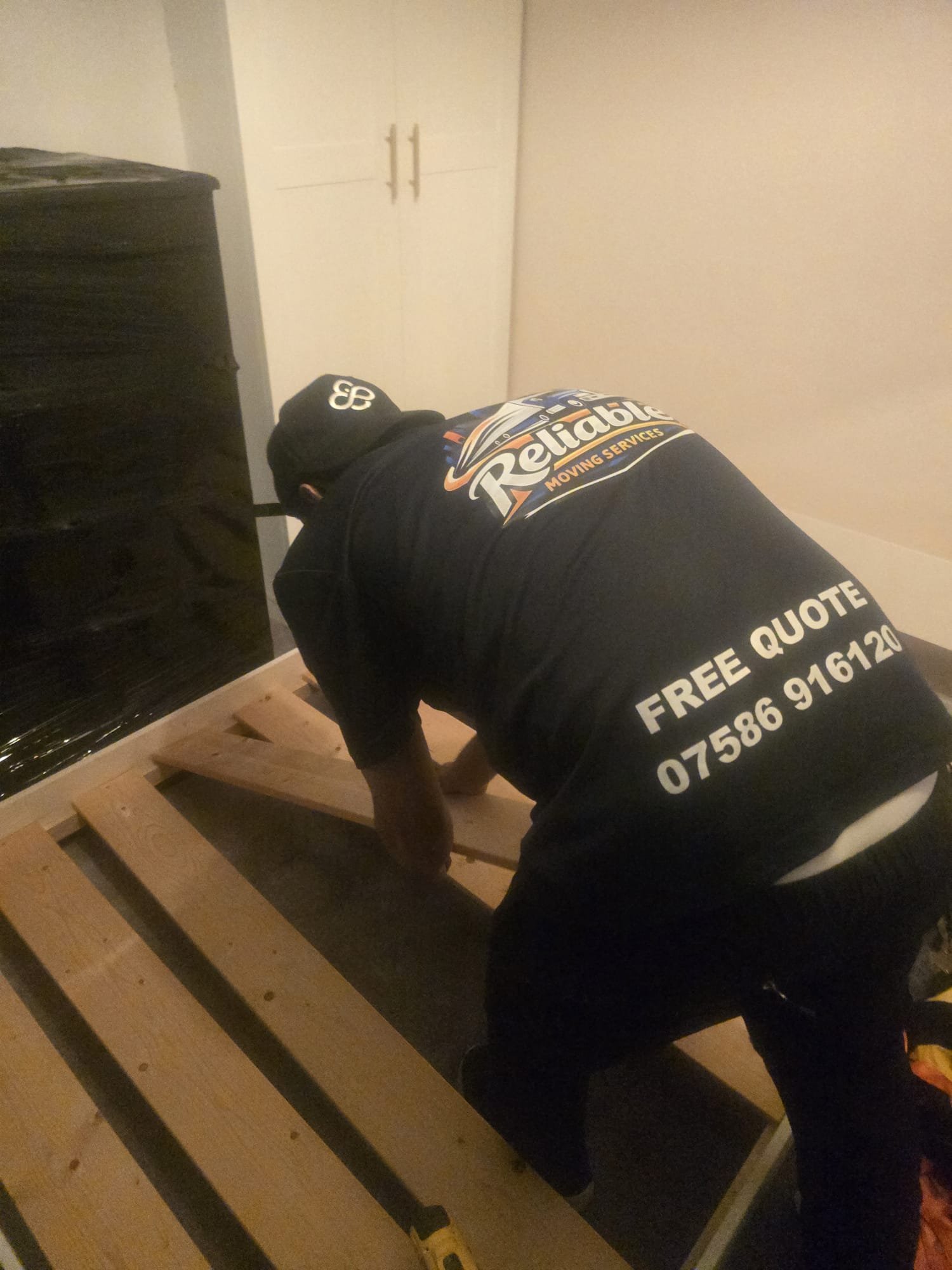 Mover fitting bed slats in a new home in Kingston upon Thames