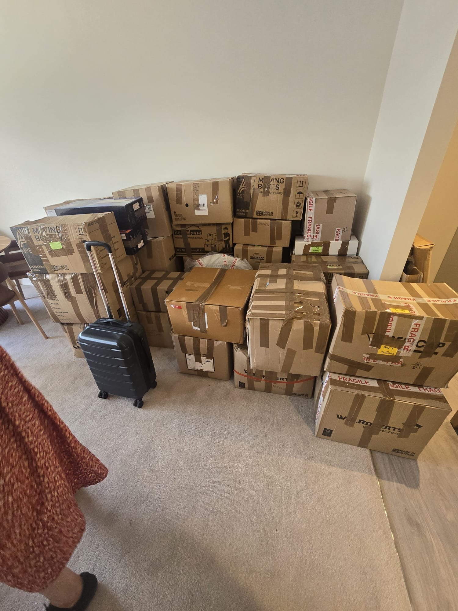 Packed boxes delivered and stacked neatly in the living room - removals in Richmond