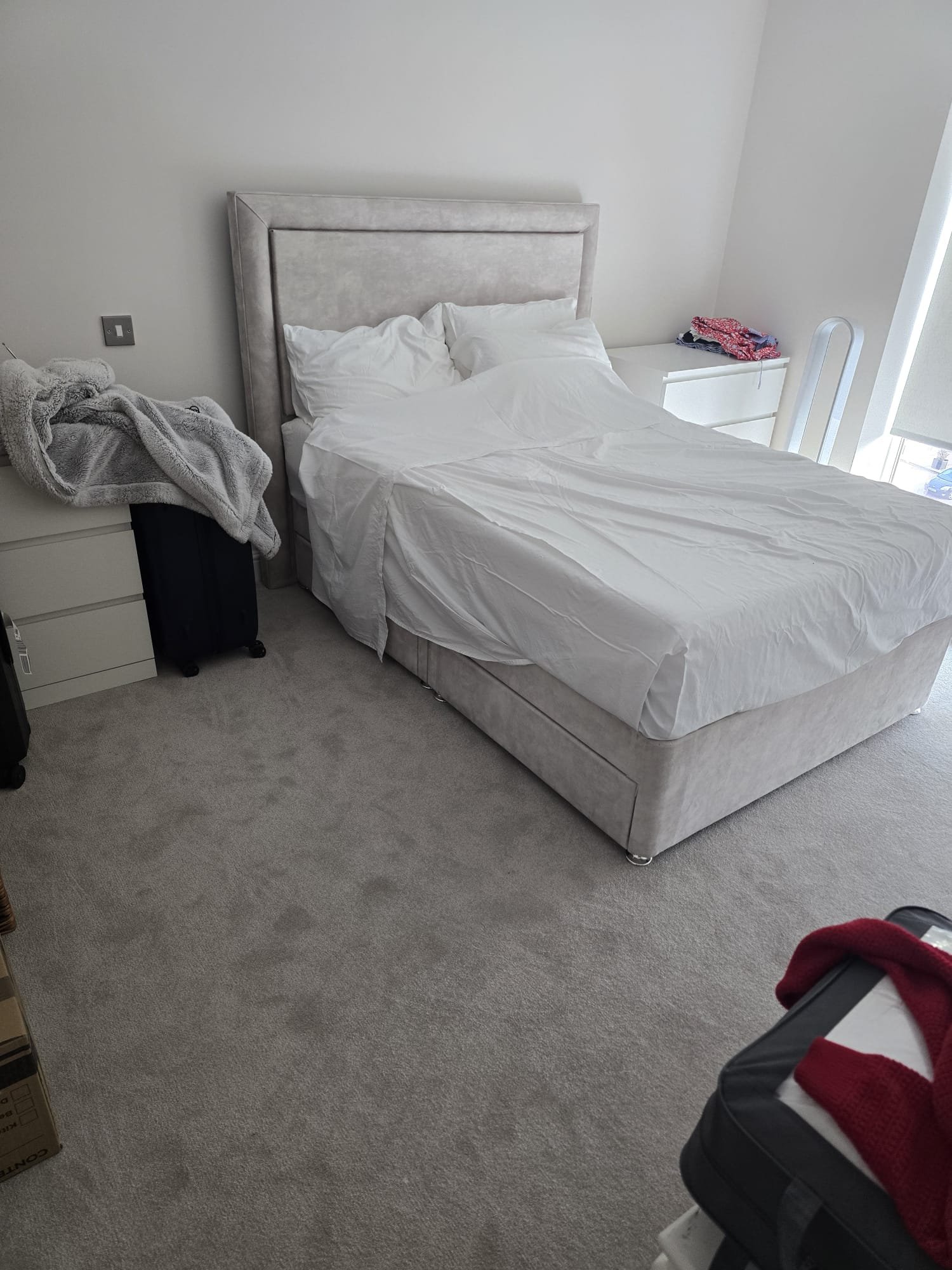 Second bedroom with the upholstered bed assembled and bedside drawers in place