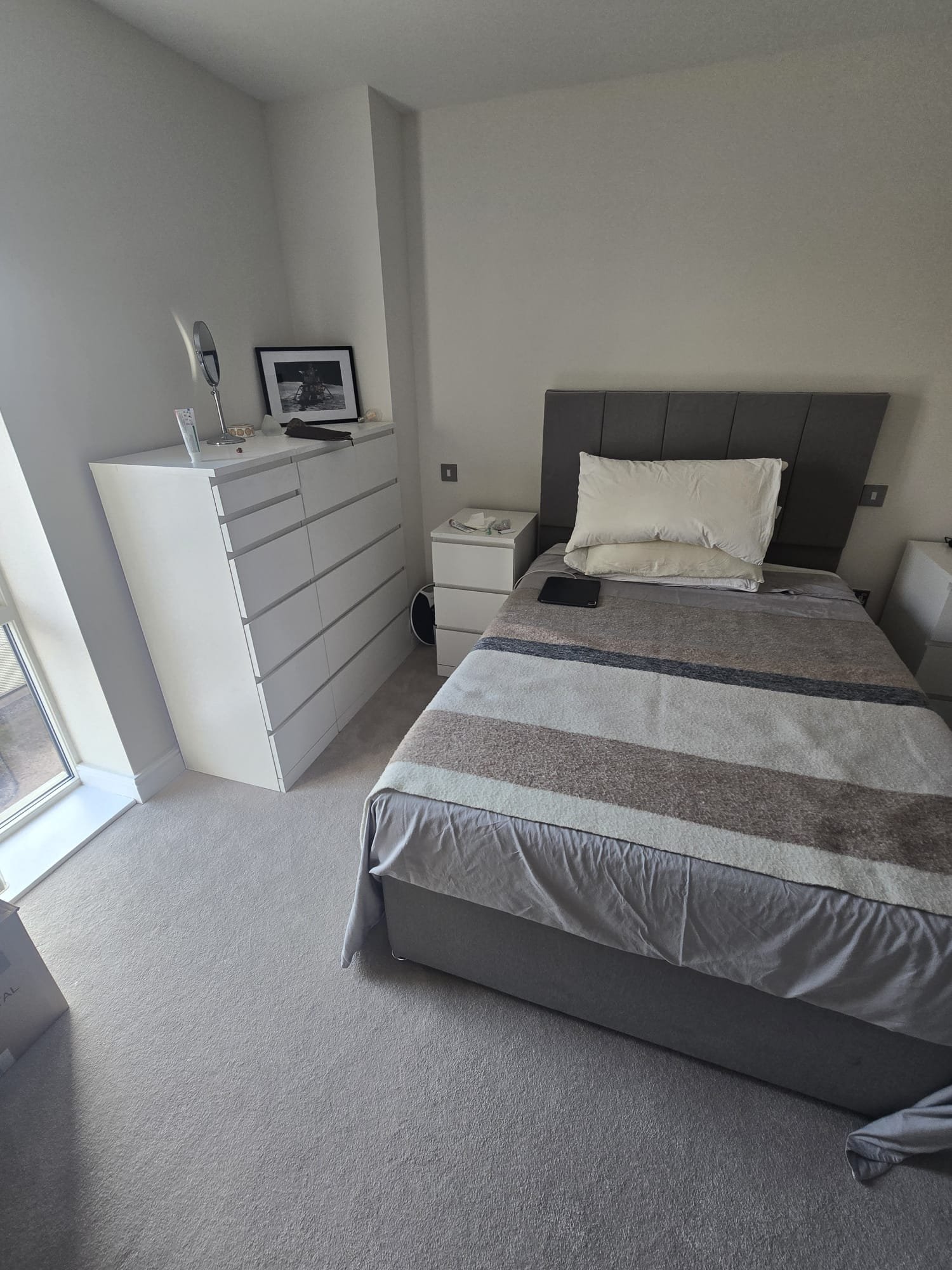 Finished bedroom with the bed rebuilt and made, and the chest of drawers in place